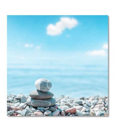 Cuadro piedras apiladas junto al mar en calma